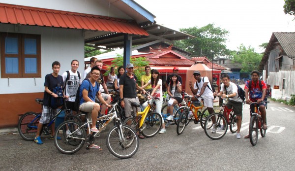 Oscar (first from left) with his classmates & professor during a cycling trip to Pulau Ubin